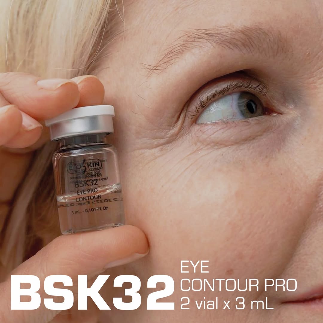 BSK32 Eye Contour Pro serum vial held near eye, 3mL anti-aging eye care treatment
