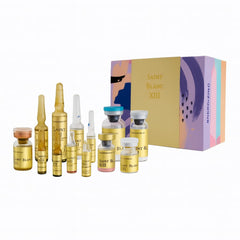 Saint Blanc XIII skincare ampoules and vials with colorful energizing gift box for aesthetic care routines